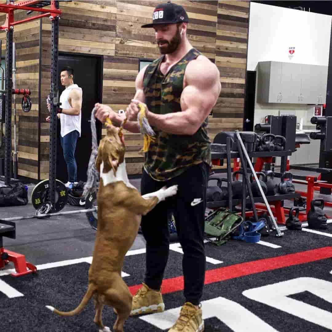 American fitness guru Bradley Martyn playing with his dog.